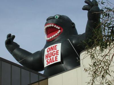 Giant black gorilla promotes consumer spending.
