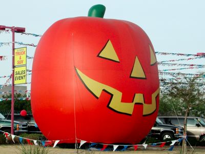Giant pumpkin sells used cars.
